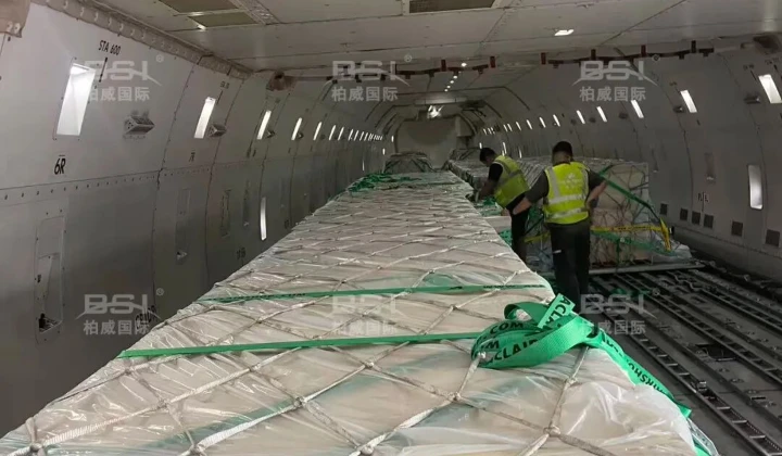 Staff reinforce cargo on the plane